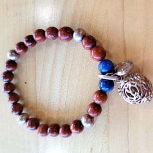 Bead bracelet with aromatherapy  diffuser charm. Brand is LH
